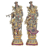 Brass Radha Krishna statue full-length side view, ornate jewelry and patterned skirt