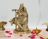 Brass Radha Krishna statue idol with Radha standing beside Krishna on a pedestal