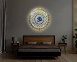 OM LED wall hanging glowing on wall, round gold mandala with Om centerpiece