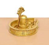 Angled view of Shiva Ling murti in brass with carved base and central ling