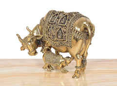 Brass cow and calf figurine, side view, polished finish with ornate border details