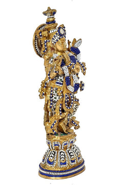Brass Krishna figurine, standing pose with flute, blue robe with white gemwork