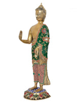 Standing Buddha statue side view, brass gold body, green robe with red dot trim and blue base