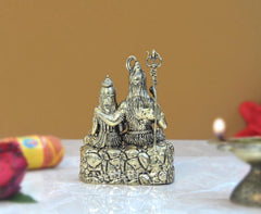 Brass Shiva and Parvati rear view, seated figures with tall crown and trident