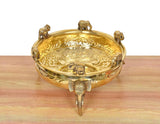Golden brass urli with elephant figures and ghungroo, engraved top, open bowl