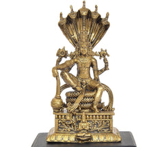 Vishnu idol with four arms, seated pose, detailed gold-tone jewelry and base