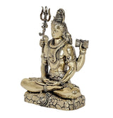 Brass Lord Shiva idol seated, trident in one hand, drum in other, detailed ornaments, 5 in