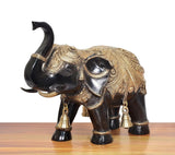 Brass elephant figurine, right-side view, black body with gold filigree and bells