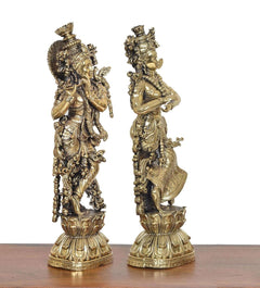 Brass Radha Krishna idol pair, side view with intricate armor-like ornaments