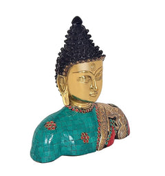 Brass Buddha bust statue angled view, gold face and black hair, teal red mosaic robe