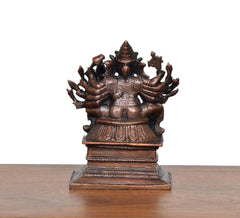 Copper Lord Ganesha statue with Riddhi, rear view of detailed arms and headgear