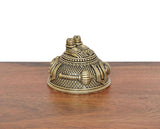 Side view brass Hanuman Charan Paduka idol with textured grid and raised ornament