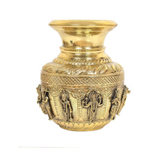 Brass kalash showpiece with front deity reliefs and patterned leaf rows