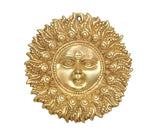 Gold brass Surya dev wall hanging showing calm facial features within decorative ring