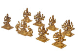 Eight Ashta Lakshmi mini statues in gold-tone brass, multi-armed poses on square bases