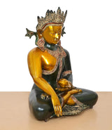 Brass Buddha statue in bhumisparsha mudra, golden left arm and dark green body