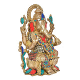Side view of seated Brass Mangalkari Ganesh statue with jeweled hands and ornaments