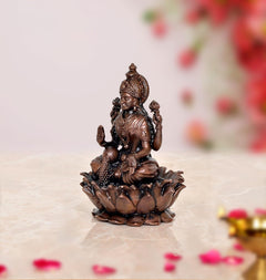 Copper Laxmi Maa statue side view, seated on lotus with raised hands, 3.5 in