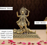 Mahakaali idol on patterned bronze pedestal, arms raised; 4 inch height