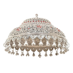 Silver carved chattar dome with red accents and dangling bell fringe