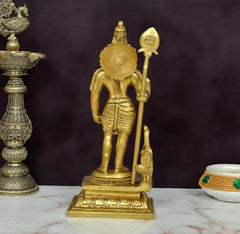 Brass Kartikeya figurine viewed from behind, spear and peacock mount at the base