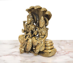 Side view: Maa Lakshmi and Lord Vishnu brass statue seated on Sheshnag serpent coils