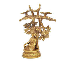 Golden brass Buddha tree idol, side view of seated Buddha beneath bird-and-leaf canopy