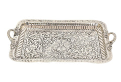 Ornate silver-toned rectangular tray with floral engraving and side handles