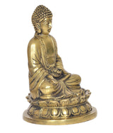 Three-quarter view of gold brass Buddha statue in Dhyan mudra, seated on base