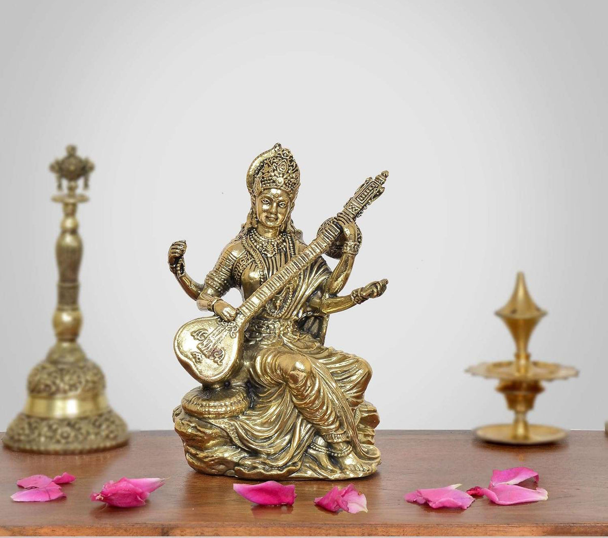 Brass Maa Saraswati statue, seated playing veena on lotus base, 5 inch