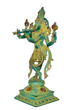 Standing Krishna playing flute sculpture, teal-green body with gold ornaments and raised base