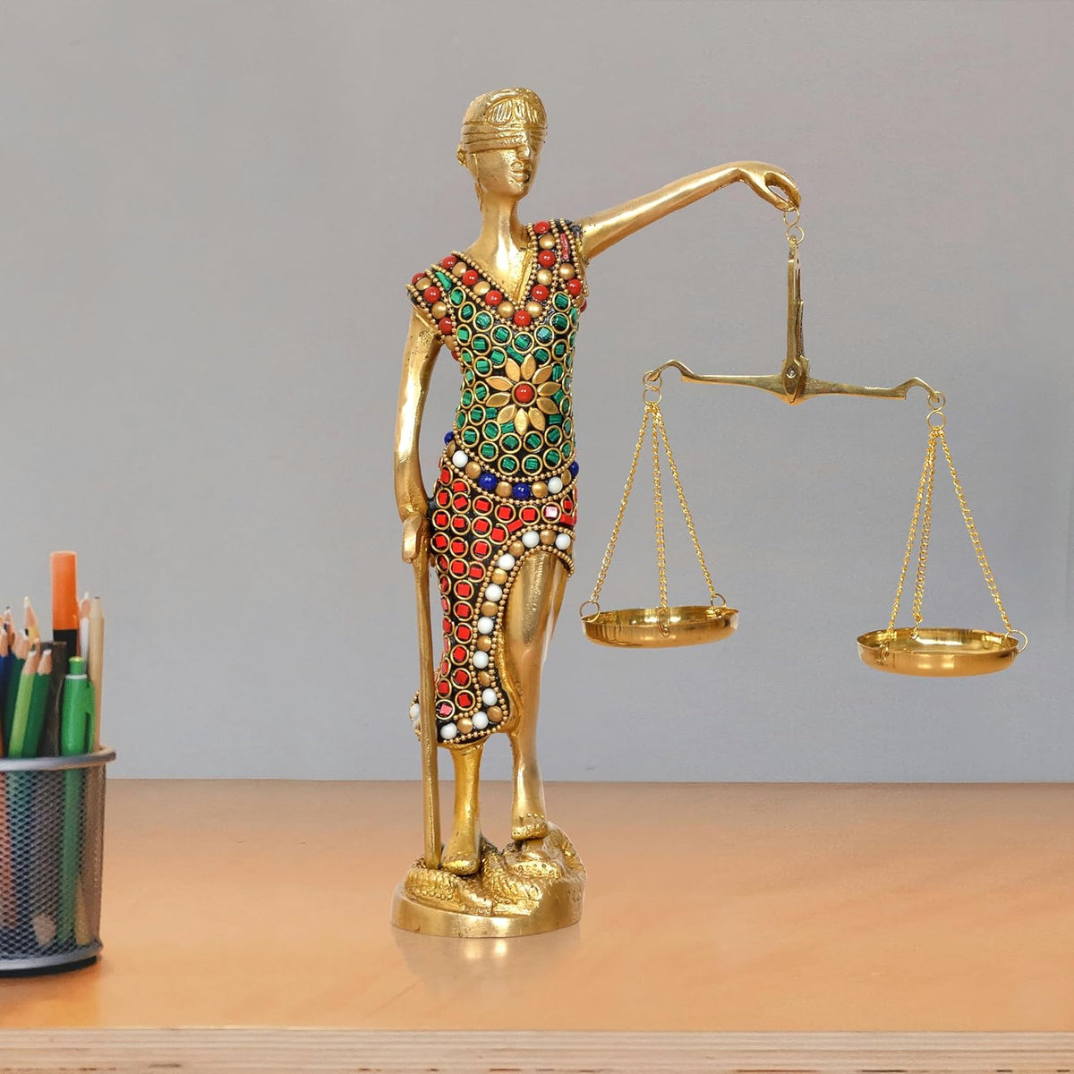 Golden brass Lady Justice idol with blindfold, jeweled dress, holding balance scales