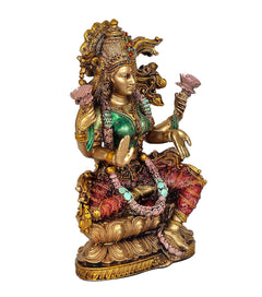 Lakshmi resin idol angled view, gold crown, green torso, red patterned sari, holding hands
