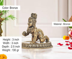 Bronze 3-inch laddu Gopal idol with jeweled crown, holding a small ball, on base
