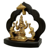 Brass Gaja Lakshmi seated idol with two elephant attendants on dark wooden base