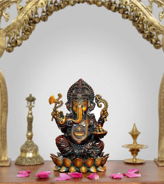 Lord Ganesha brass idol seated, holding utensils, on lotus base; 5 inch