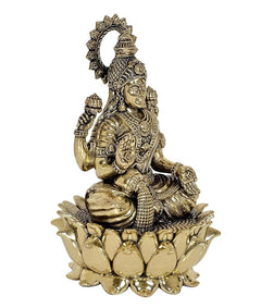 Back/side view Lakshmi brass idol statue on lotus base, ornate head halo