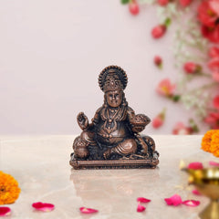 Copper Kuber idol statue, 2-inch seated figure with raised hand and blessing pose