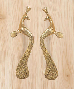 Brass peacock door handle pair—two lever handles with textured scale pattern