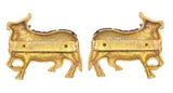 Brass cow pair wall hanging, back side with mounting holes and gold-toned finish