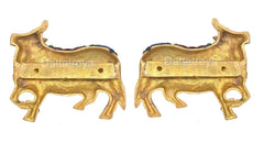Brass cow pair wall hanging, back side with mounting holes and gold-toned finish