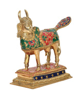 Brass cow showpiece, green-red pattern on back, blue dot band on base