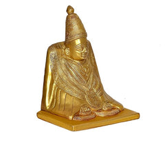 Brass Tulja Bhavani idol, angled view seated figure with raised crown