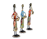Iron musician lady set of 3, angled view with patterned dresses and tall boots