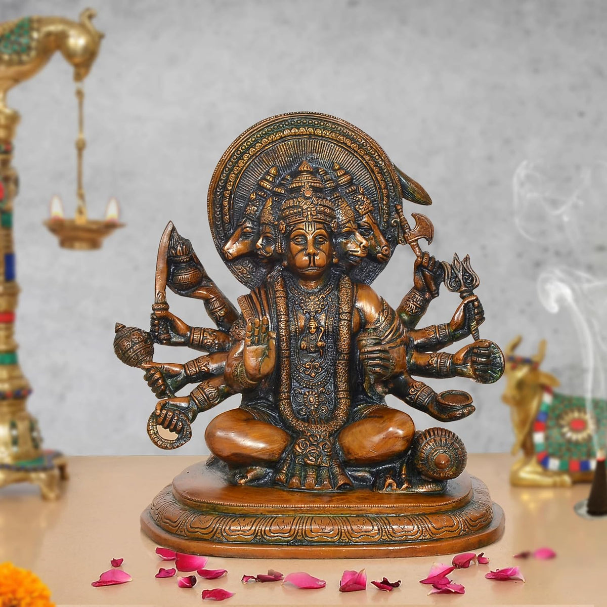 Brass Panchmukhi Hanuman idol with seated multi-armed figure, ornate halo and jewelry