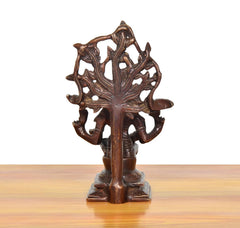 Brass Dakshinamurti Shiva murti rear view, carved flowing motifs and base