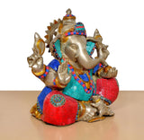 Brass Ganpati Bappa murti close angle, gold face with multicolor beaded trim and crown