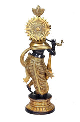 Back/side view of Krishna flute-playing statue, gold radiant disc headdress, round base
