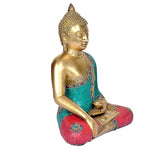 Brass Buddha murti side profile, seated with hands in bhumisparsha mudra and teal robe