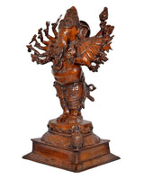 Side view of brass Ganesha statue with 16 hands and trunk, mounted on pedestal